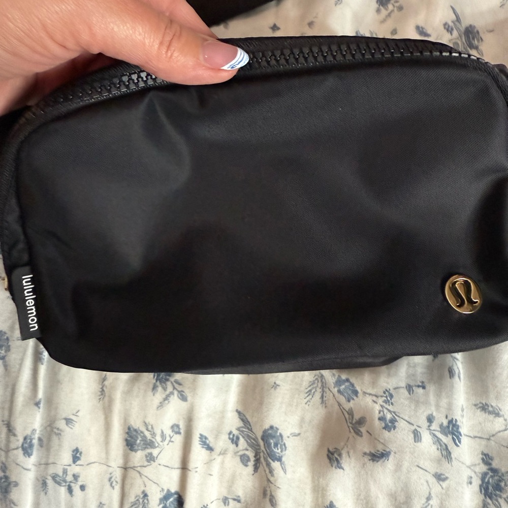 Never used black Lululemon belt bag with GOLD hardware